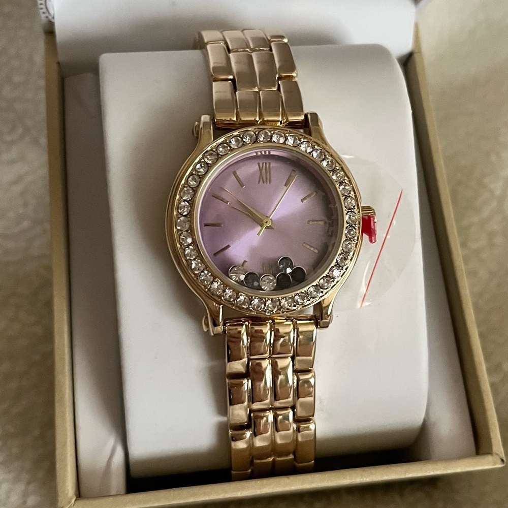 Gold Tone Purple Watch with Moving Gems